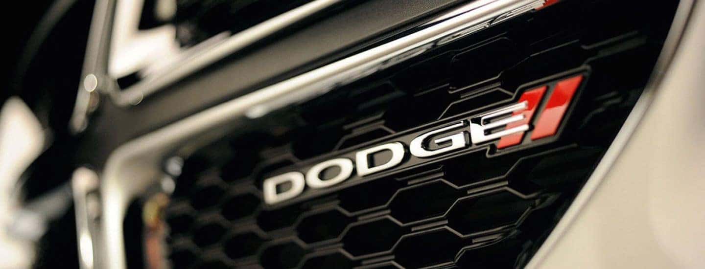 The grille of the Dodge Grand Caravan The Dodge emblem on the Dodge Grand Caravan Grille