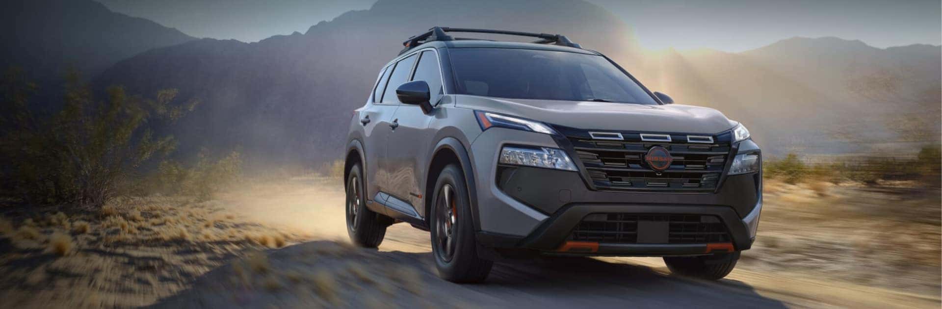 Nissan SUV driving on the dirt road