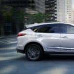 White 2020 Acura RDX Driving Through City