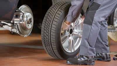 Putting Tire on Car