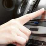 Finger on Dashboard With GPS Panel and TV/DVD/Audio System