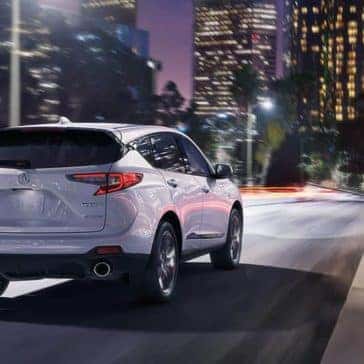 2020 Acura RDX driving on city street at night