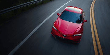2026 Acura Integra A-Spec top-down view in red, driving on a road