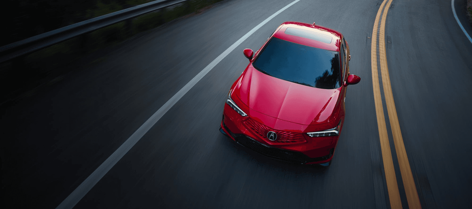 2026 Acura Integra A-Spec top-down view in red, driving on a road