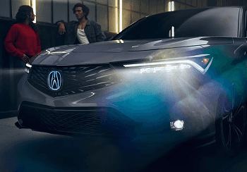 Close-up of 2026 Acura Integra front grille with illuminated Acura emblem
