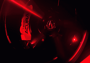 Close-up of 2026 Acura MDX wheel with red Acura-branded brake caliper