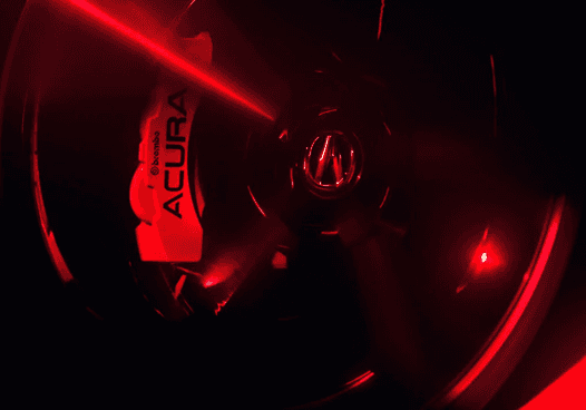 Close-up of 2026 Acura MDX wheel with red Acura-branded brake caliper