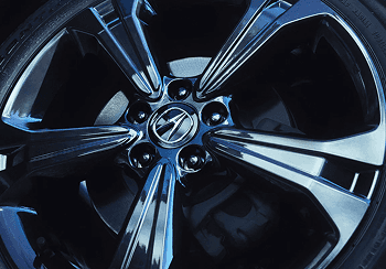 Close-up of 2026 Acura RDX dark alloy wheel with Acura center cap