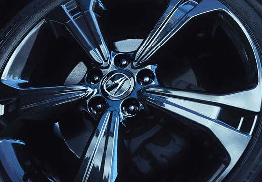 Close-up of 2026 Acura RDX dark alloy wheel with Acura center cap