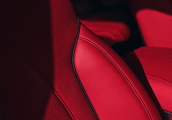 Close-up of 2026 Acura RDX red perforated leather seats