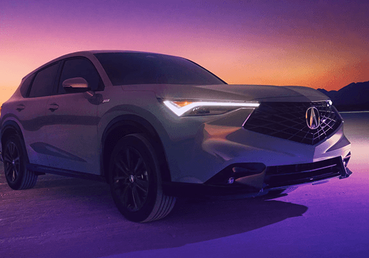White 2026 Acura ADX A-Spec parked on reflective salt flats at sunset