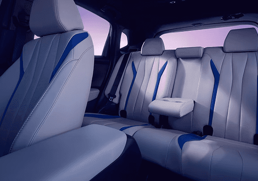 2026 Acura ADX rear cabin with white leather seats and blue accent stitching