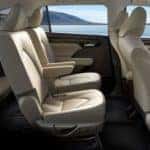 Inside of 2020 Toyota Highlander with tan seats at sun outside