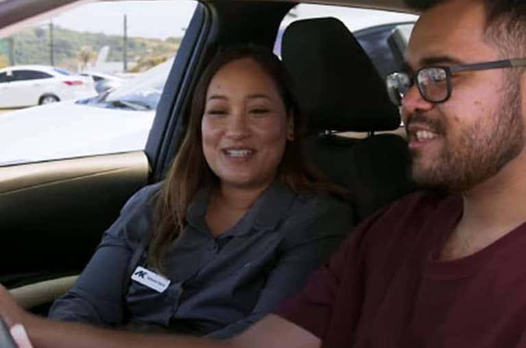two people inside a vehicle