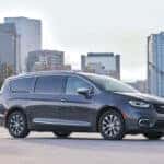 2023 Chrysler Pacifica Hybrid set against a cityscape