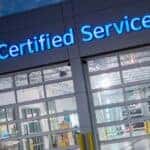 Certified Jeep service sign lit at night