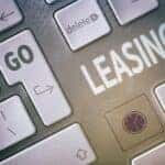 A keyboard with an enter button that says "GO" with an arrow directing to "LEASING", symbolizing a Jeep lease