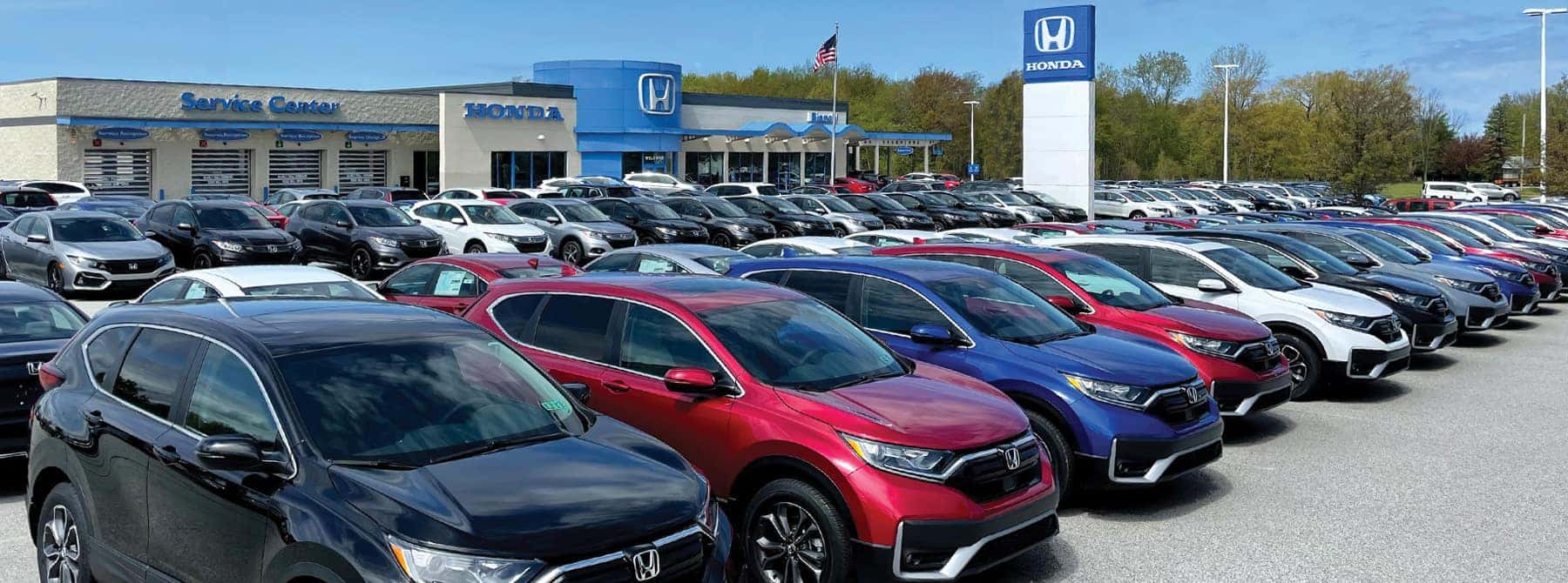 An exterior shot of a Honda dealership.