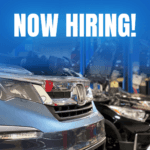 now hiring picture with service shop in background blue overlay with white text saying now hiring!