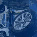 tire leaning on a pillar in a honda service shop wiht blue gradient overtop