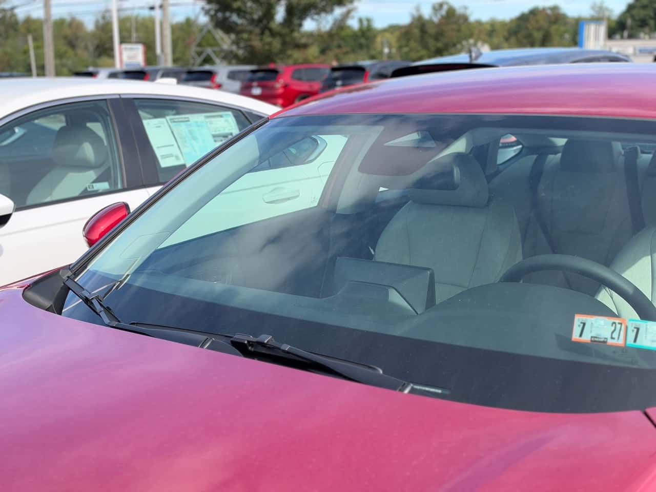 Red Honda Accord windshield with honda sensing camera
