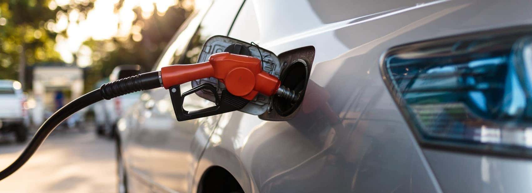 Filling up gas tank at gas station fuel economy MPG