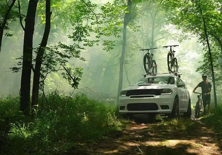 SUV parked with bikes on rooftop