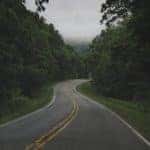 asphalt road winding through the ozarks