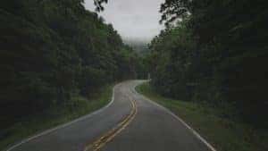asphalt road winding through the ozarks