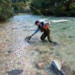 man fishing in a river