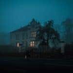 haunted house in a mist of fog in a gloomy night