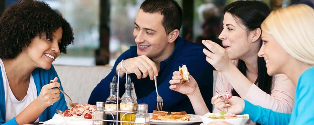 friends enjoying cafe meal