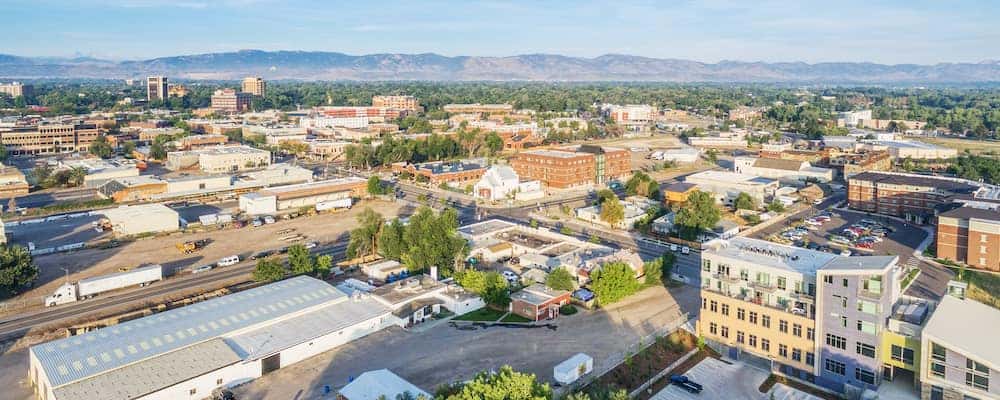 An aerial view of downtown Ford Collins with the sky in the background.