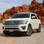 White Ford SUV in summer desert