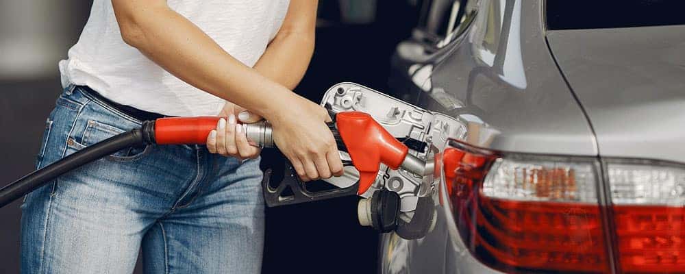 Woman Pumping Gas