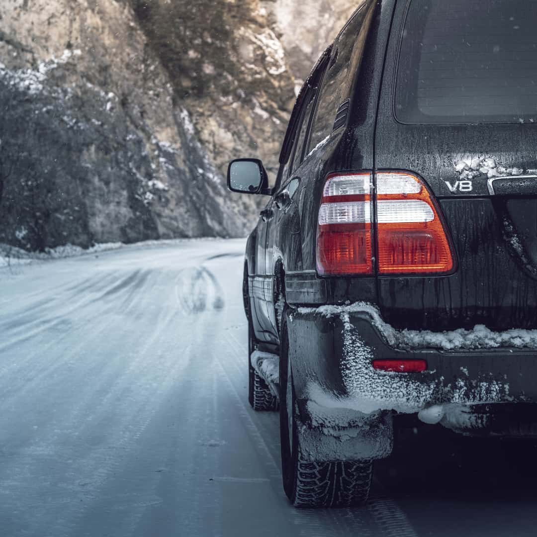 Car driving on a snowy road