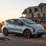 Chevy Bolt EV in front of farm house