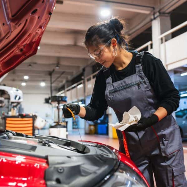 mechanic changing the oil