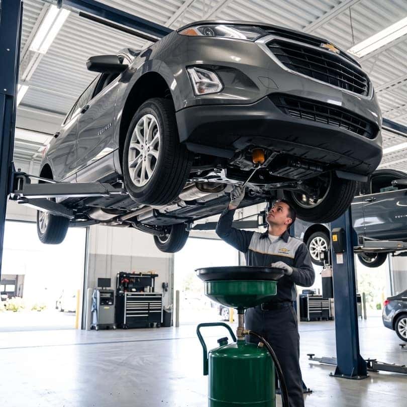 A Chevrolet SUV receiving a routine oil change service.