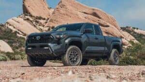 a black 2025 Toyota Tacoma parked on a dirt road