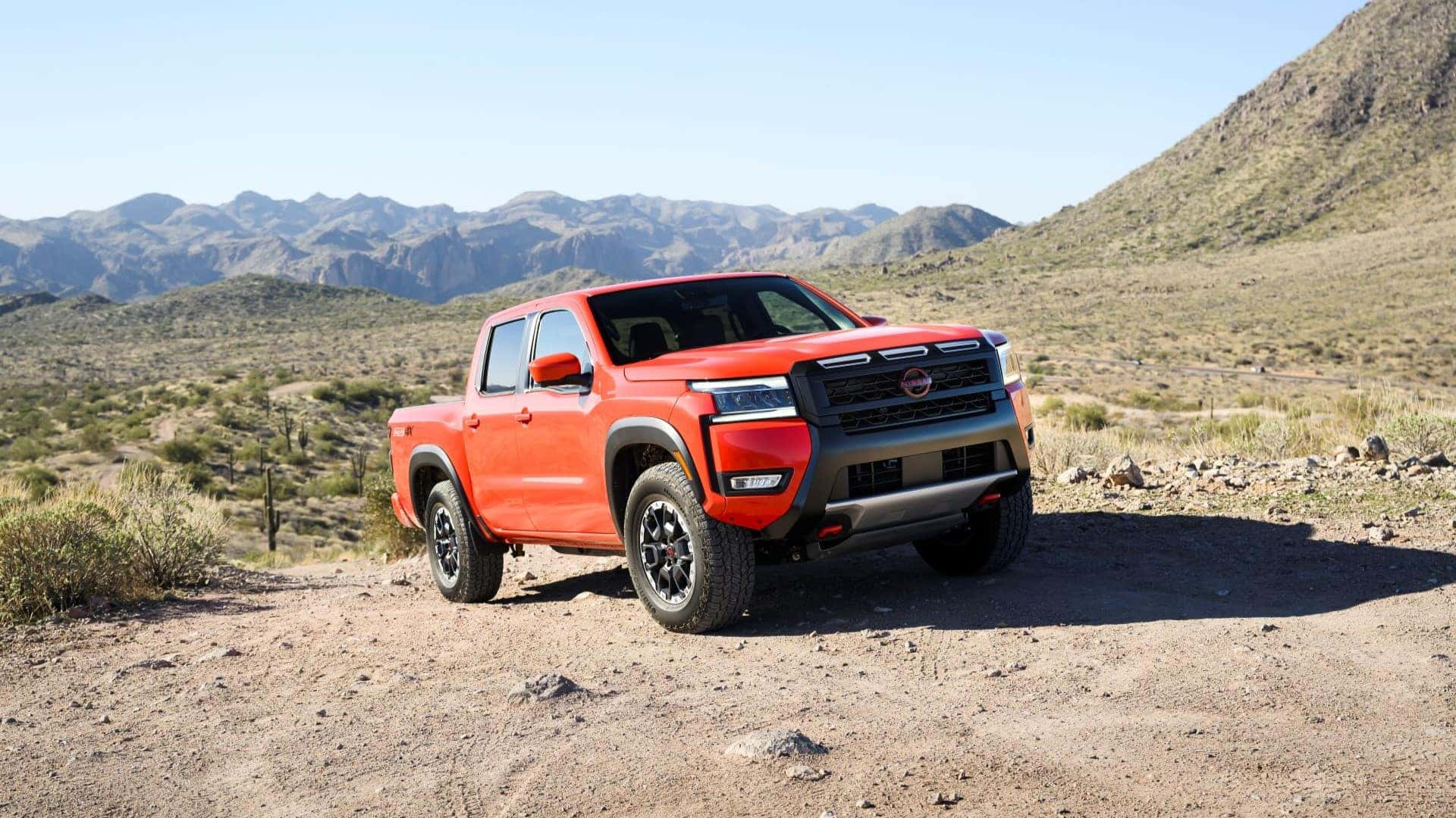 Orange 2026 Nissan Frontier showcasing its rugged design.