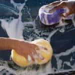 Two people washing a car - El Dorado Chevrolet in McKinney, Texas