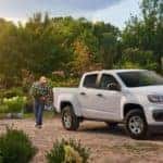 A man next to a white 2021 Chevrolet Colorado Crew Cab | El Dorado Chevrolet in McKinney, Texas