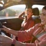 Two young women inside a 2022 Chevrolet Equinox Premier | El Dorado Chevrolet in McKinney, Texas
