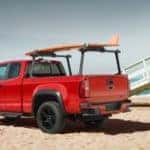 A red 2019 Chevrolet Colorado parked at a beach | El Dorado Chevrolet in McKinney, Texas