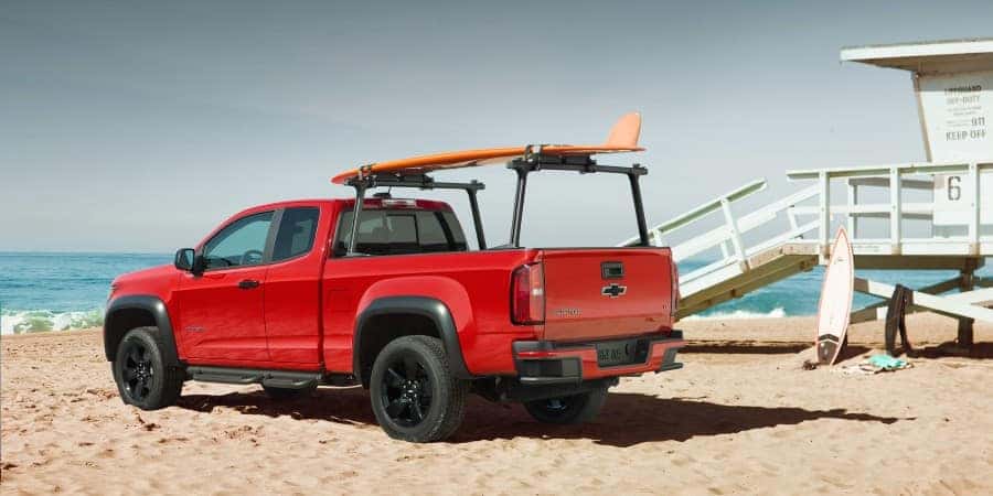 A red 2019 Chevrolet Colorado parked at a beach | El Dorado Chevrolet in McKinney, Texas