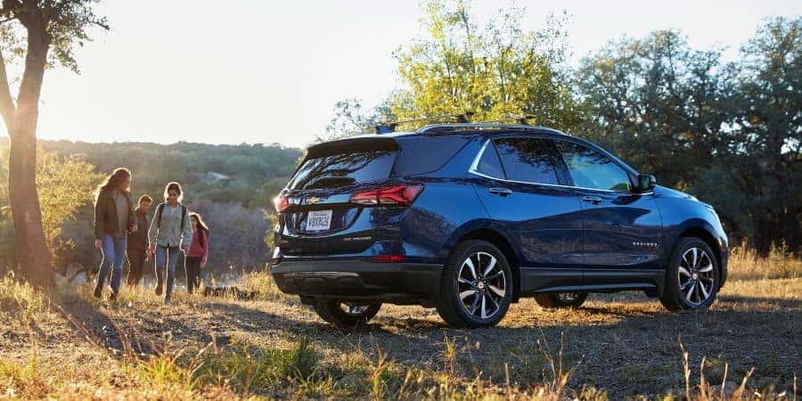 A family enjoying the outdoors next to a 2022 Chevrolet Equinox | El Dorado Chevrolet in McKinney, Texas