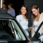 A car dealership employee assisting two customers | El Dorado Chevrolet in McKinney, Texas