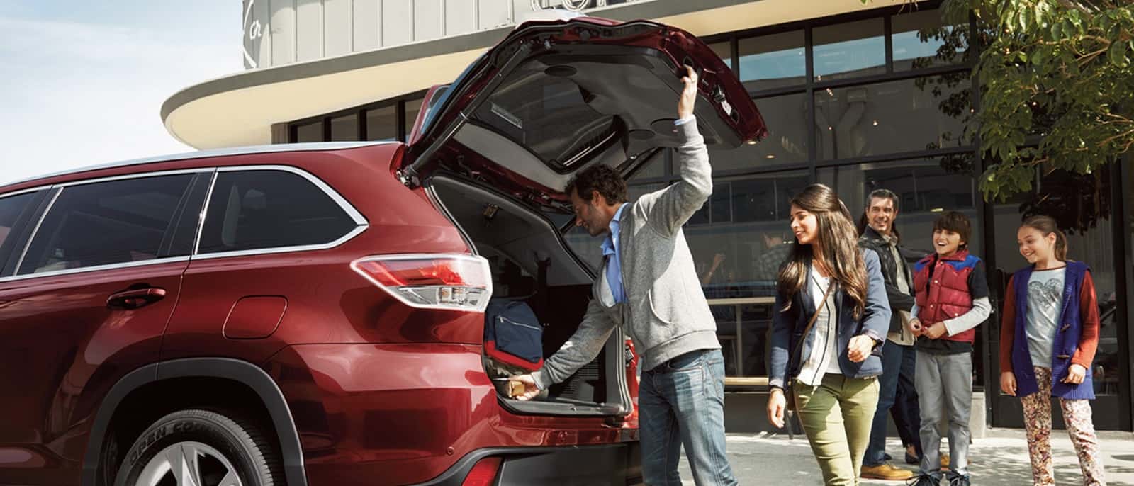 Man opening Toyota Highlander trunk