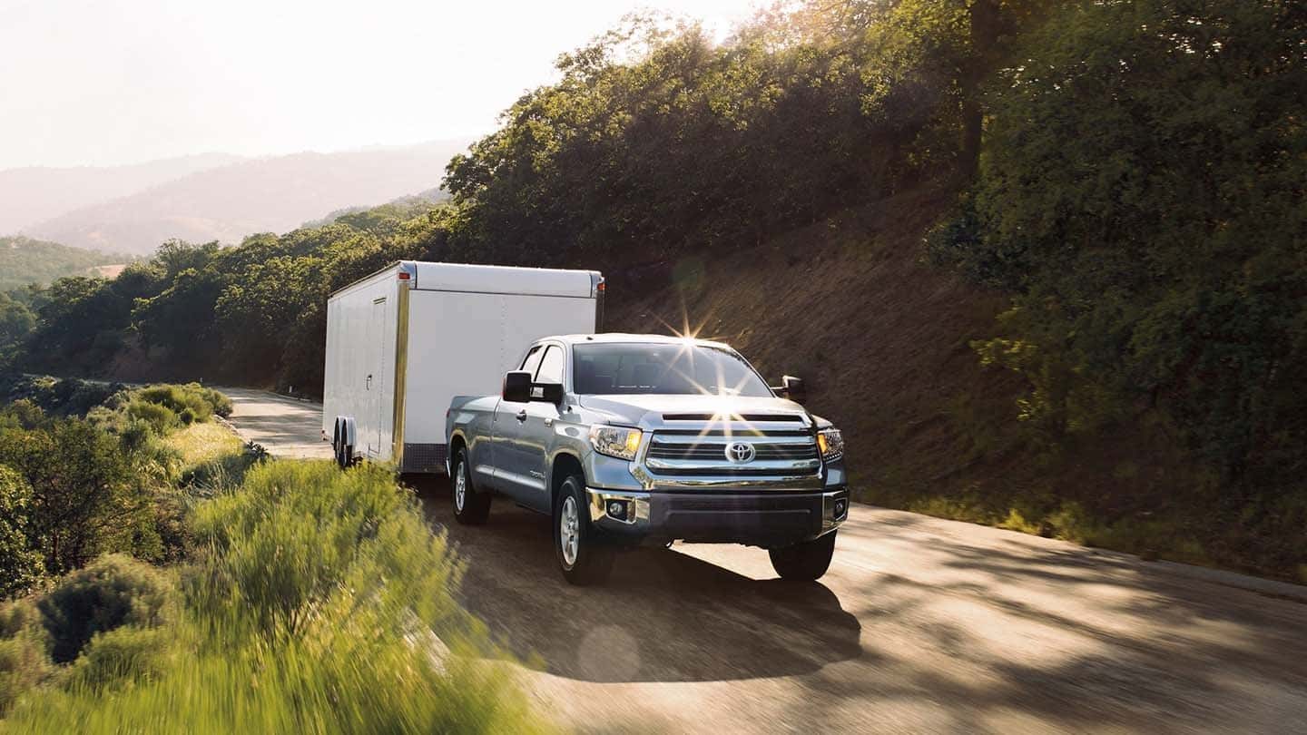 Silver Toyota Tundra Towing Trailer